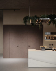 Een render van een horecagelegenheid met een bar uitgewerkt in het solid surface decor DM5048 Starstruck van Durasein, welke de luxe uitstraling van marmer op een warm witte basis biedt. De wandafwerking uitgewerkt in de FD29 Taranta van Cleaf, welke de beleving van zandsteen geeft, en een deur in de FD14 Taranta van Cleaf, een bruine steentextuur.